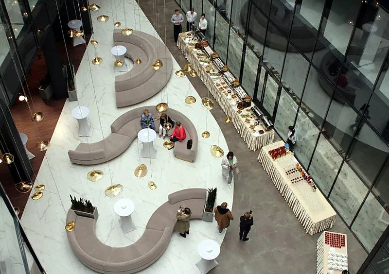 View from above of curved modular sofas in a business centre atrium