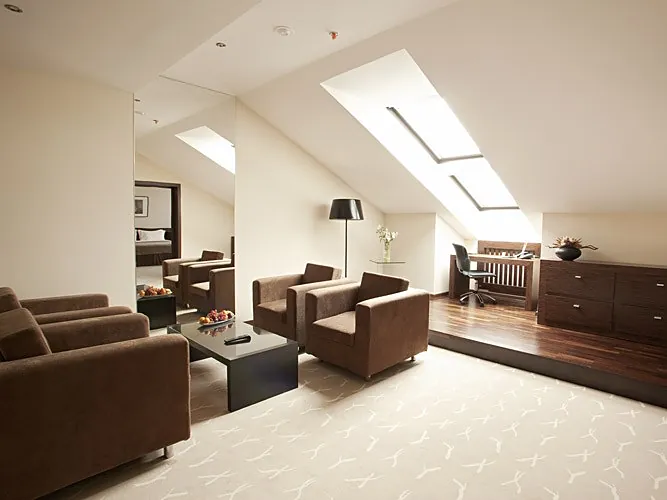 Attic suite with a sofa and armchairs