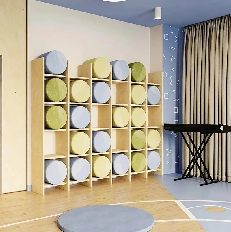 Storage wall with round upholstered cushions in green and grey