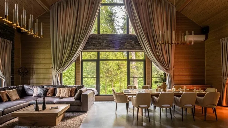 Bath house lounge with a corner sofa and a long dining table