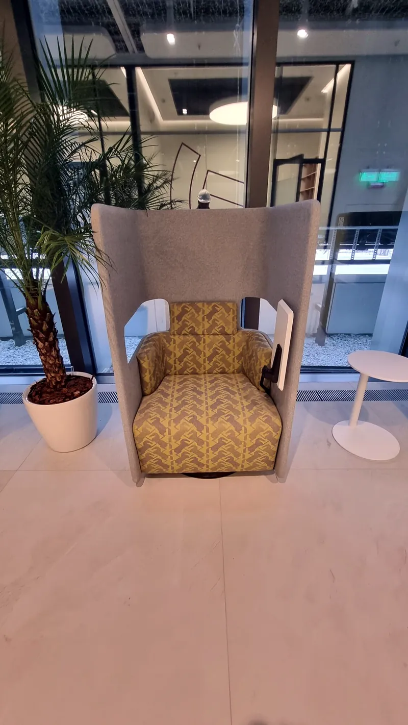 High-back armchair with a hood and patterned seat